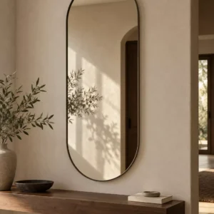 Mirae tall oval mirror with a slim blackened bronze frame